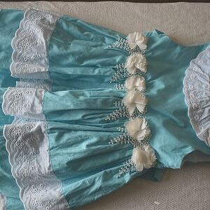100% Cotton. Blue and white girls dress size 6..Cream flowers on the waist front